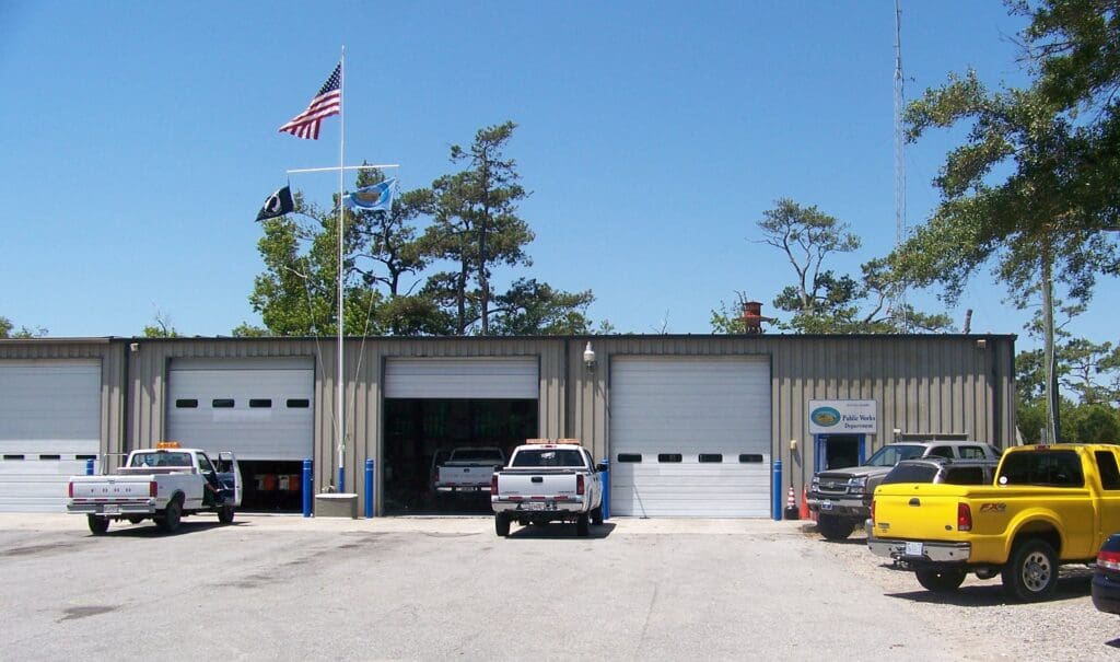 The Kitty Hawk Public Works Department metal building with vehicles out front